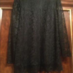 Classy black lacy blouse with lacy long sleeves.